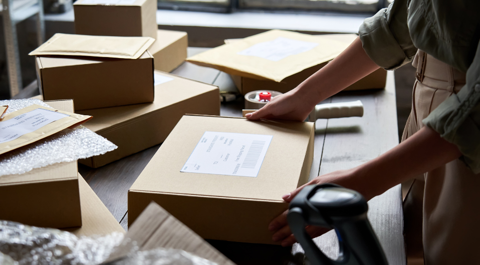 Worker attaching label and documentation to a parcel